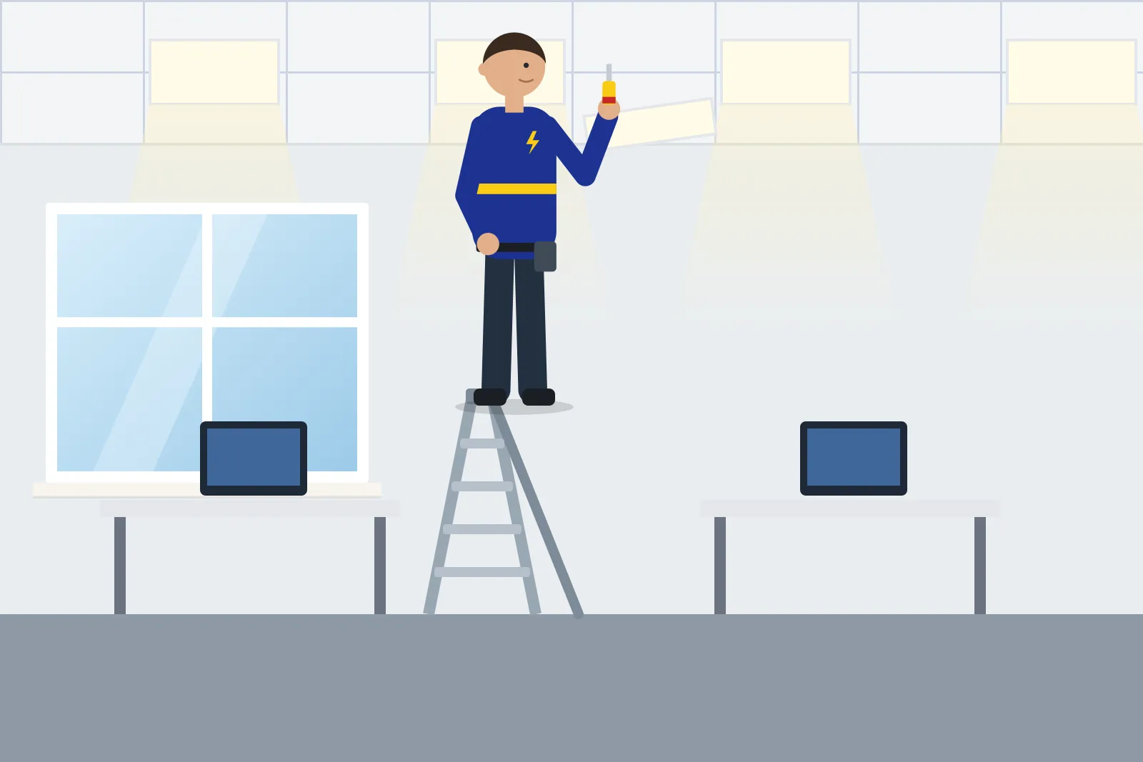 Electrician on a stepladder fitting an LED ceiling panel in an office