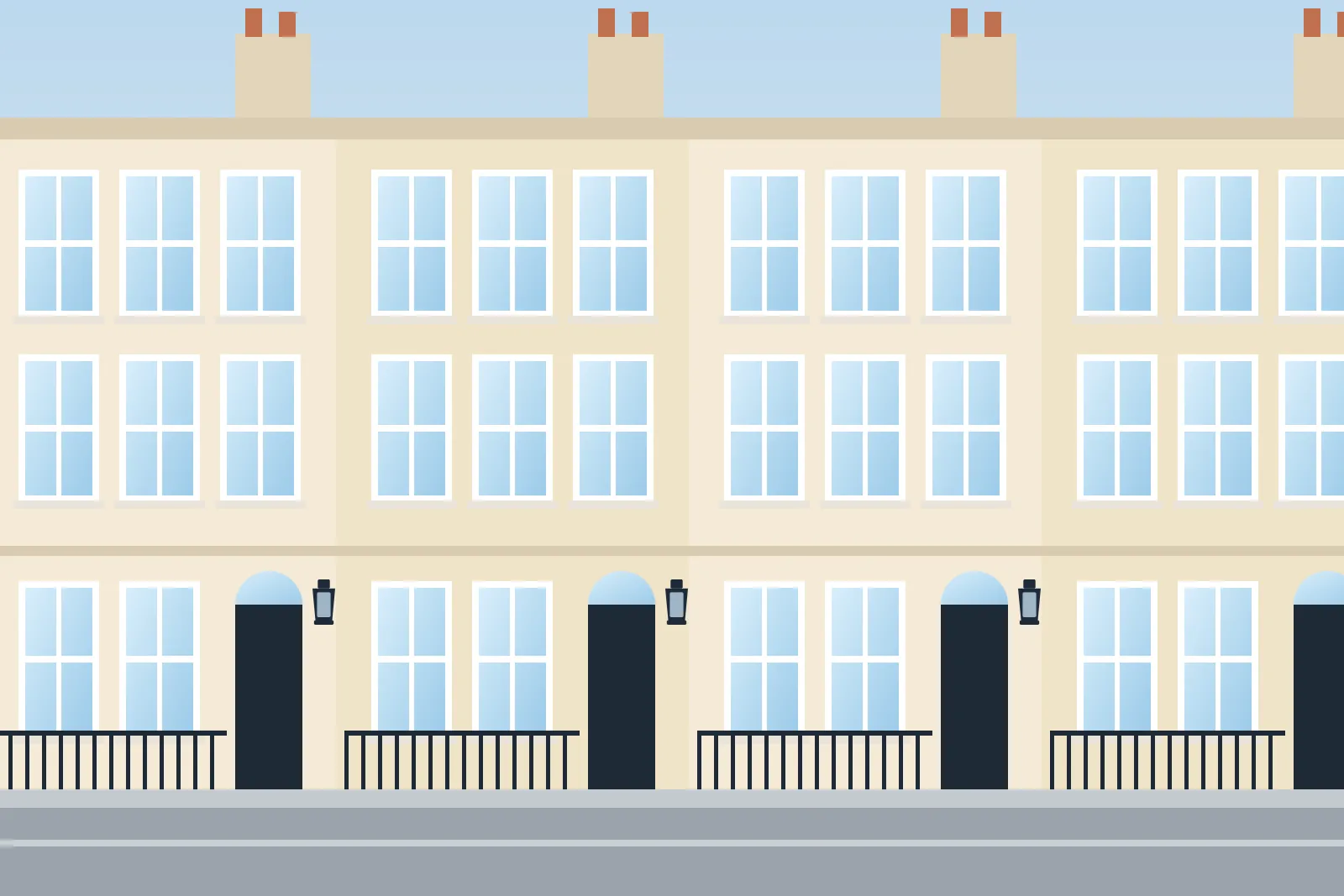 Georgian townhouses with sash windows, wall lanterns and black railings