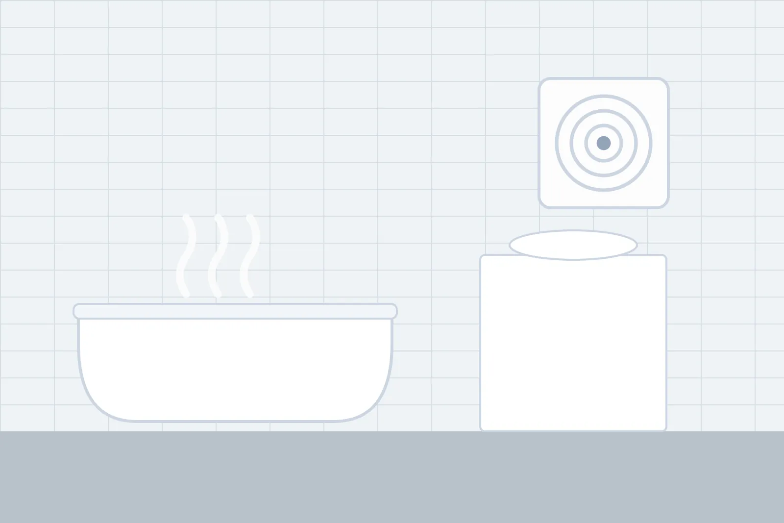 Bathroom extractor fan on a tiled wall above a steaming bath